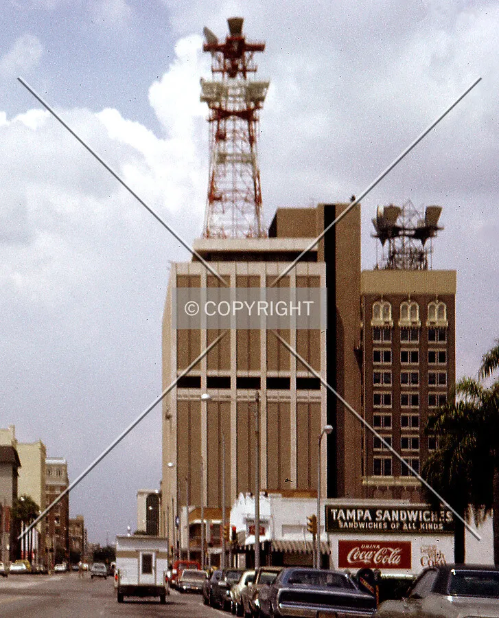 Vintage view from the northeast along East Twiggs showing the former communications tower atop the building