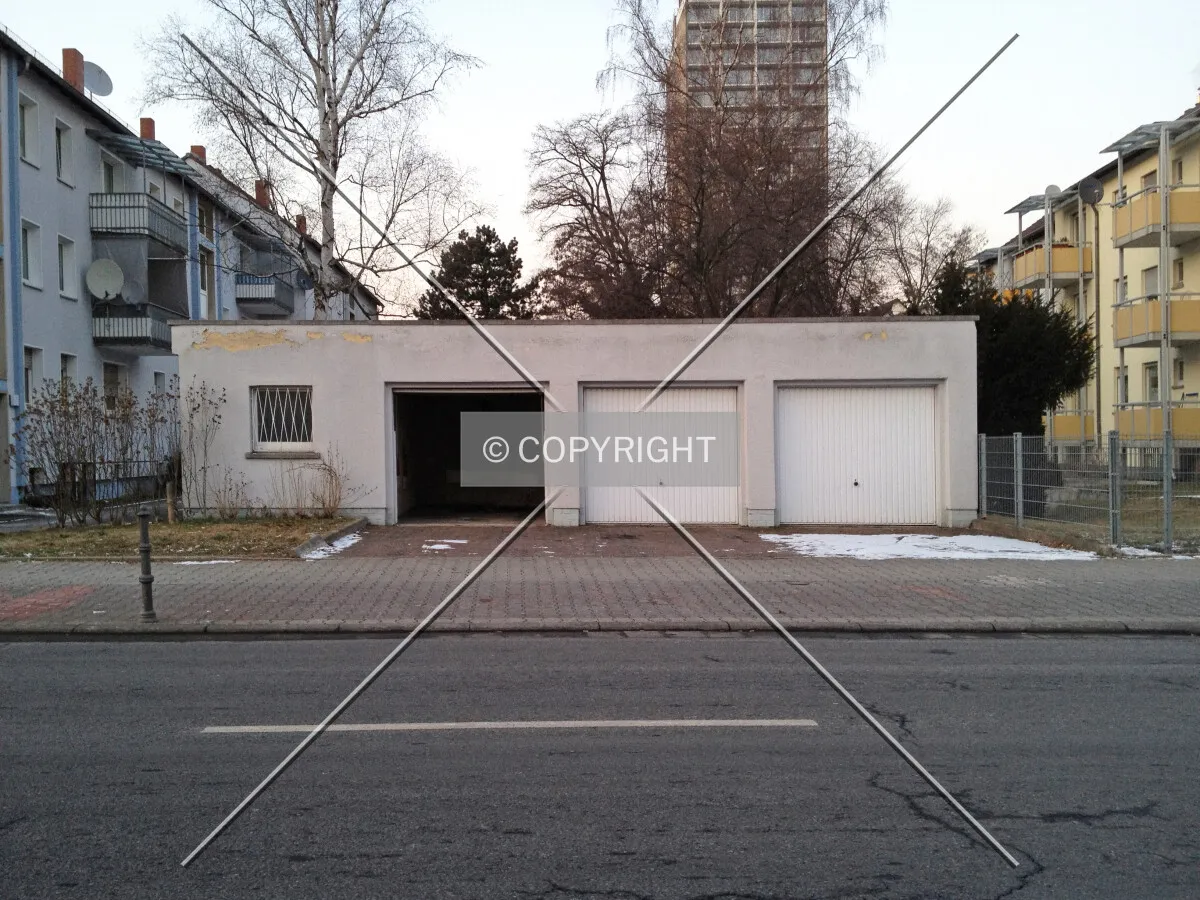 A building housing three vehicle portals