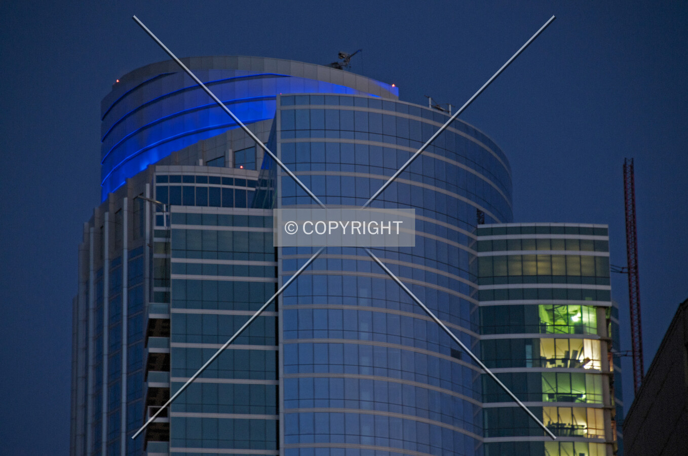 Upper floors and top viewed from the west at twilight