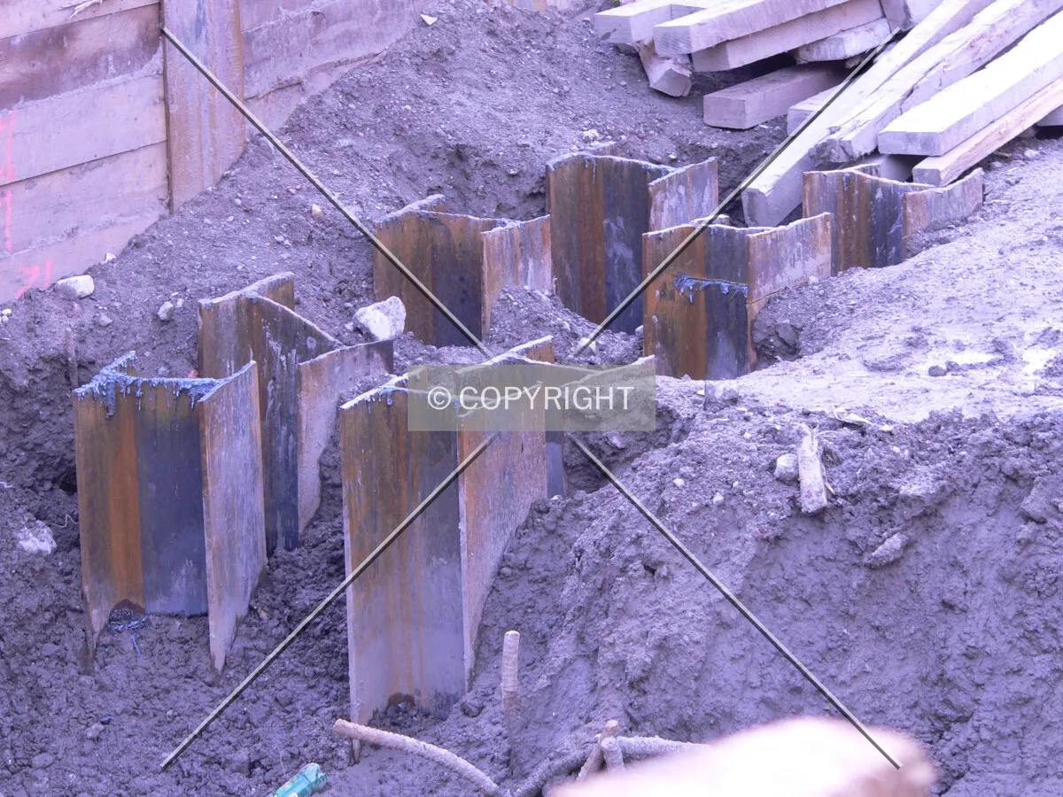 Clusters of steel piles that are visible in the southeast corner of the site