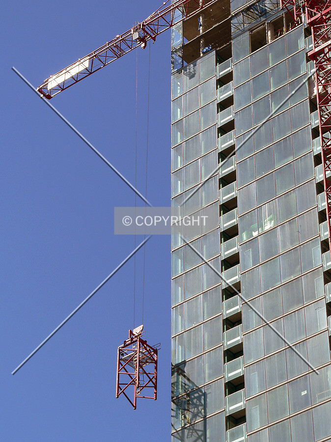 Lowering a section of tower crane