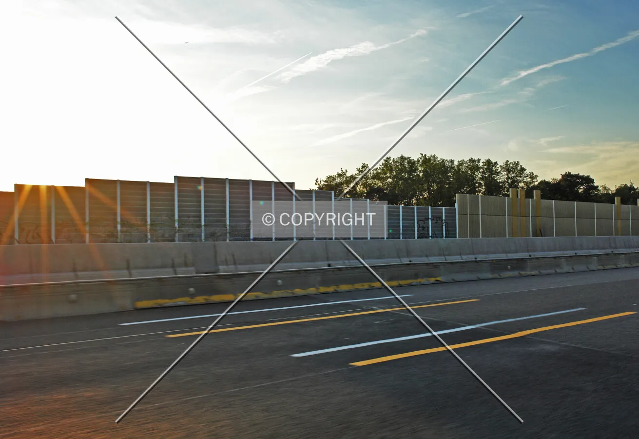 A noise reduction wall next to a highway