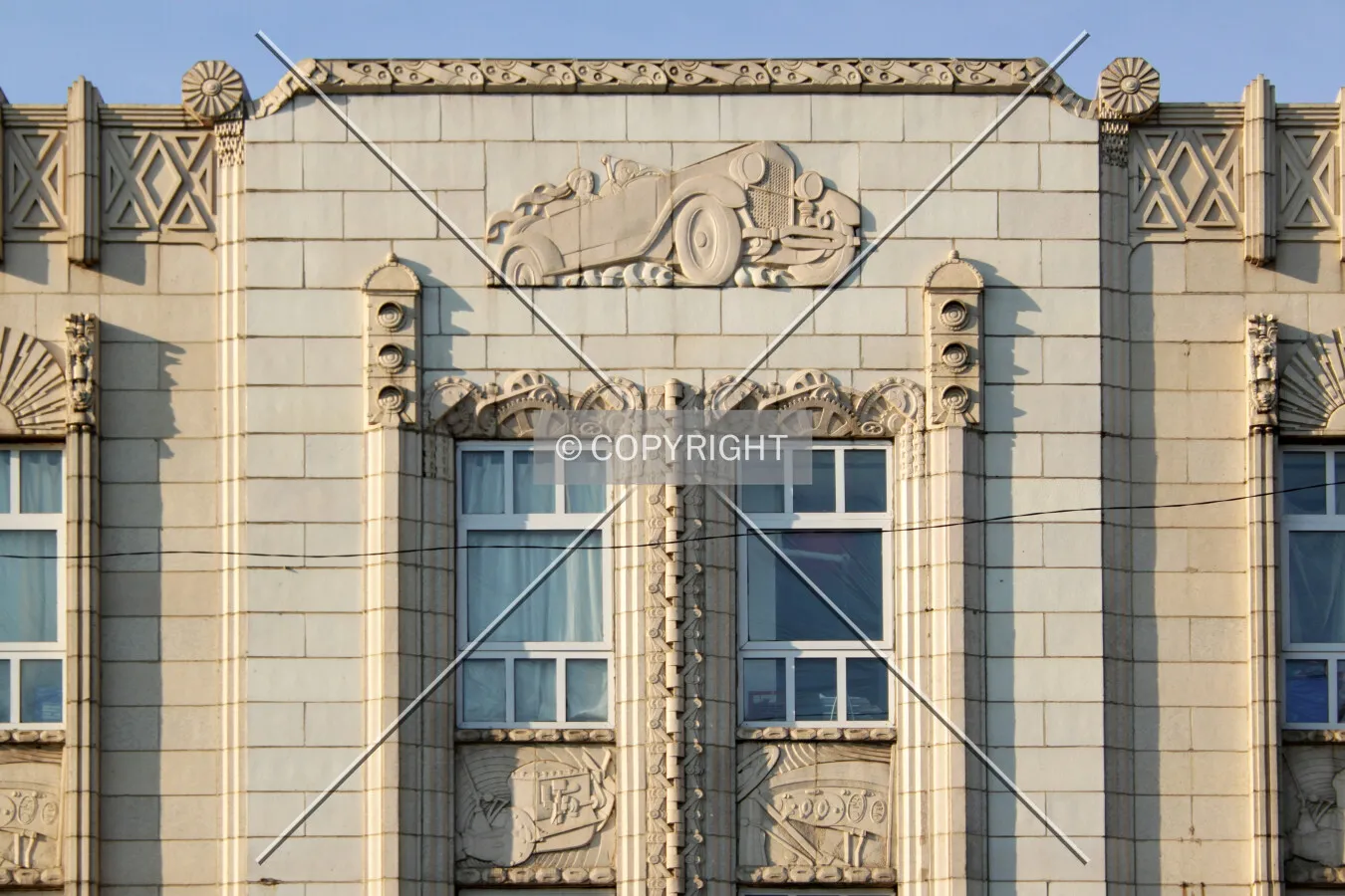 Terra cotta automobile on the north facade