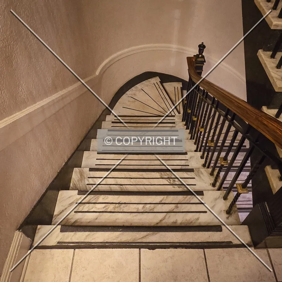 View down the stairs from the second floor; March 30, 2025