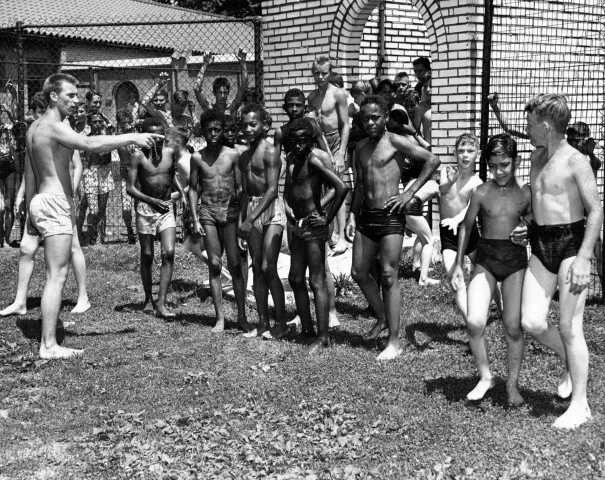 Vintage view of African-American and Caucasian swimmers