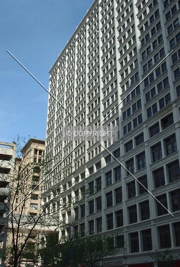 Morning shadow across the south facade, from 6th Street