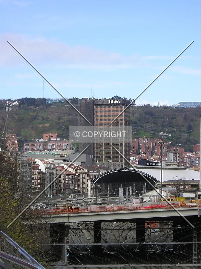 Distant view of the tower, with the Abando Central train station and the Cantalojas buildings in between