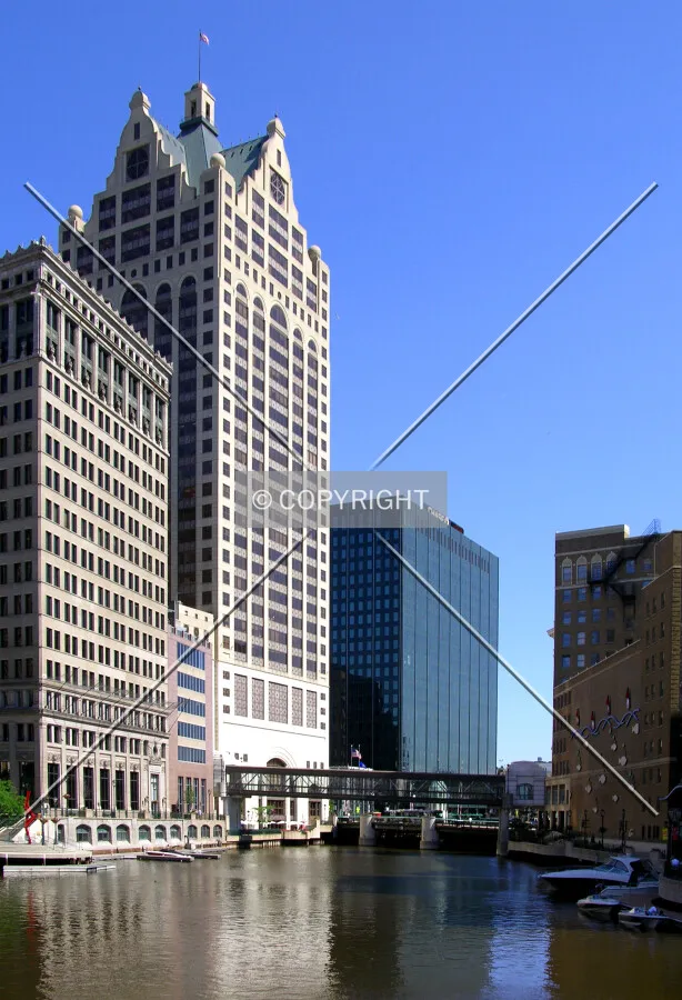 High-rises lining the Milwaukee River from the Wells Street Bridge to the north