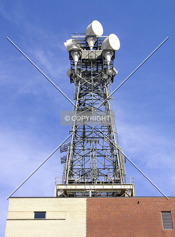 Microwave tower detail atop the building from the west