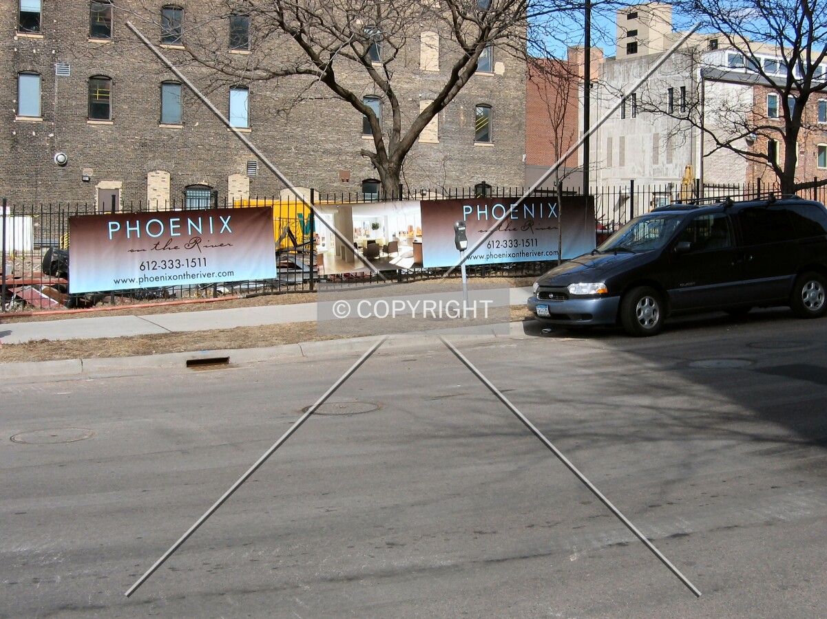 View of the sloping site from across 3rd Avenue SE