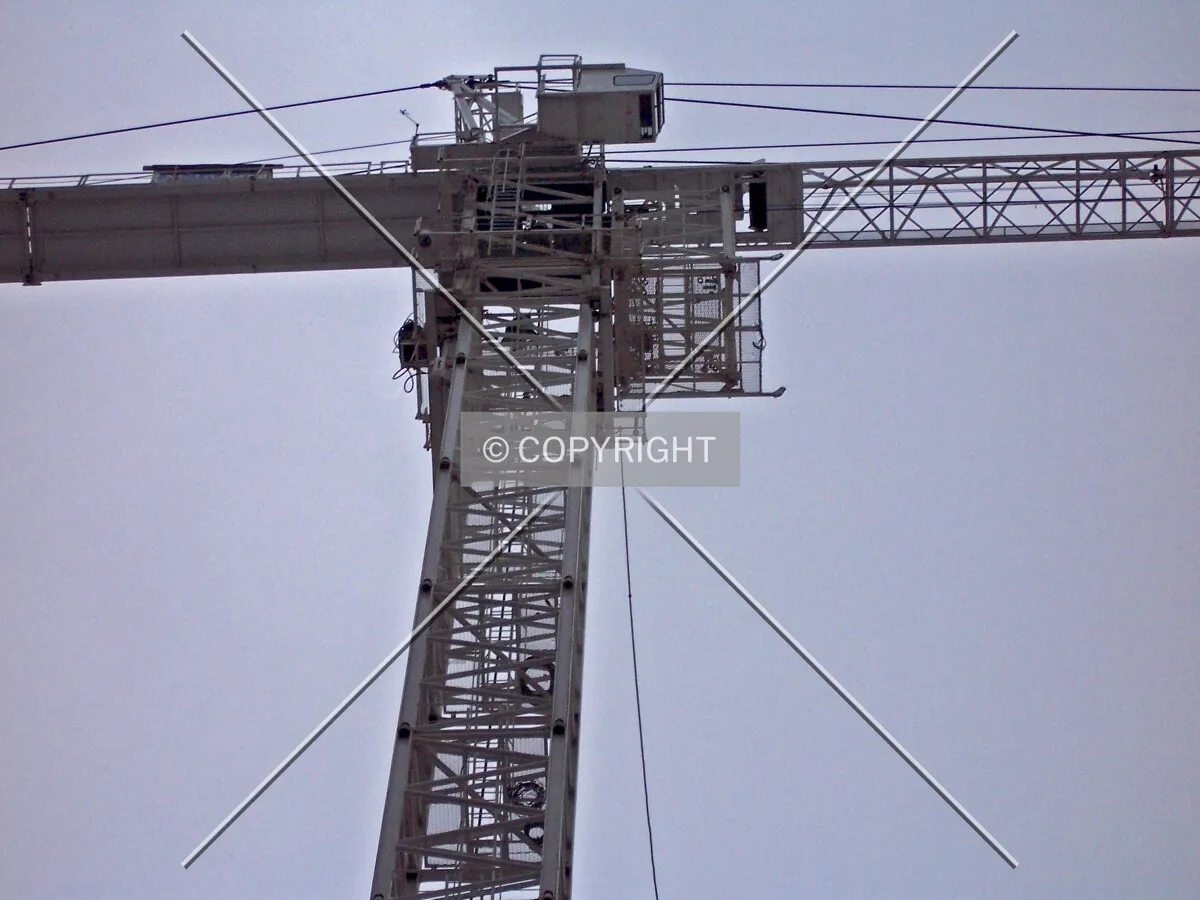 Installing a section of the tower crane shaft during a crane jump