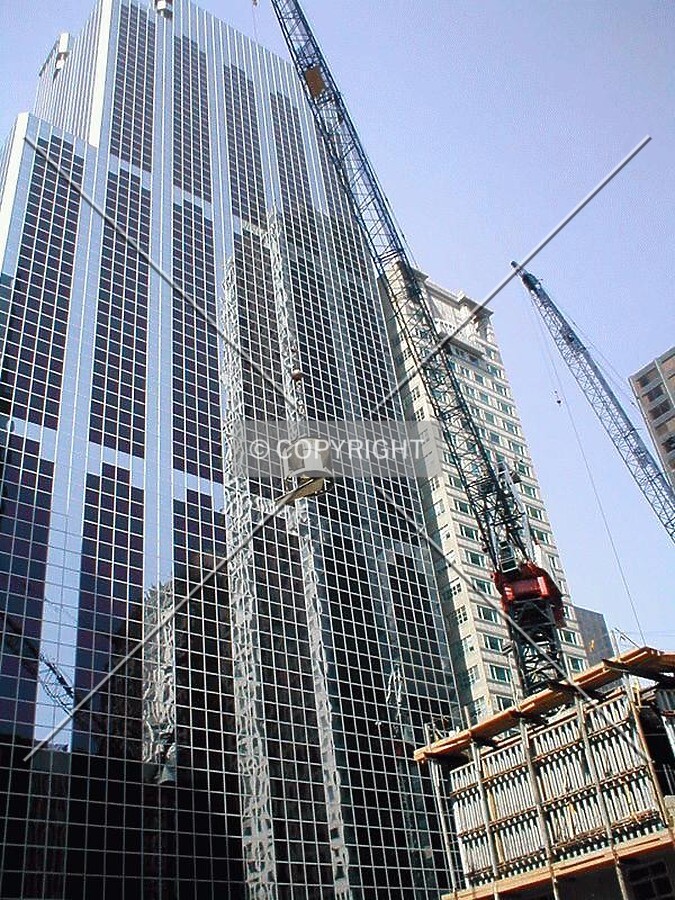 Ozinga cement being hoisted to Monroe Street side of site