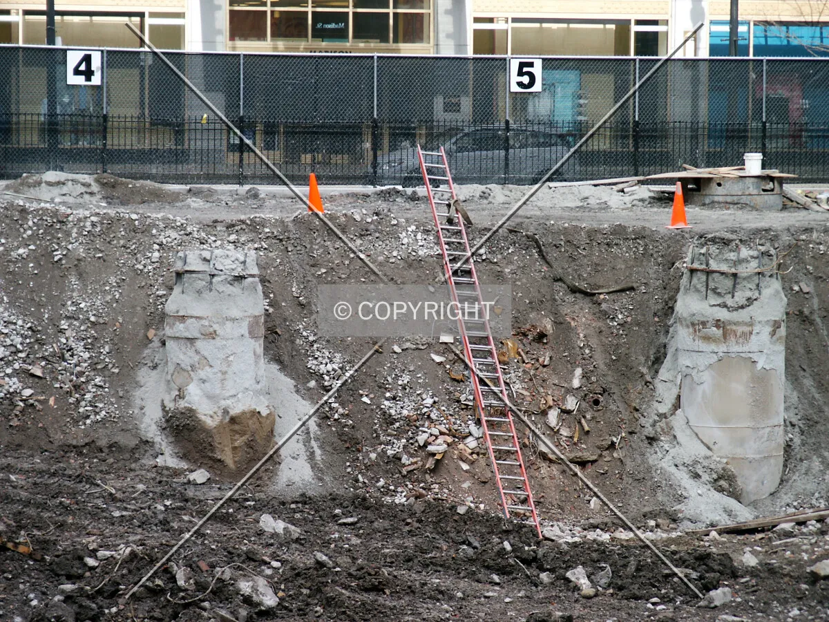 Ladder into the pit, flanked by 2 exposed caissons