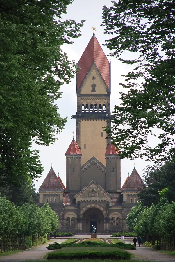 The main tower between the cemetery trees