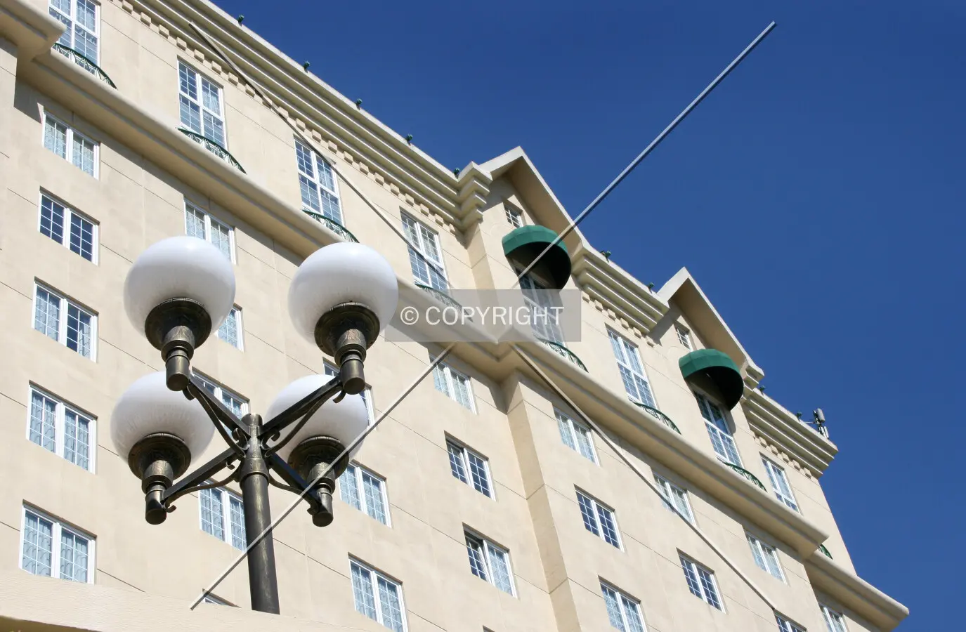 Upper floor gables with ground-level lamp post on south side