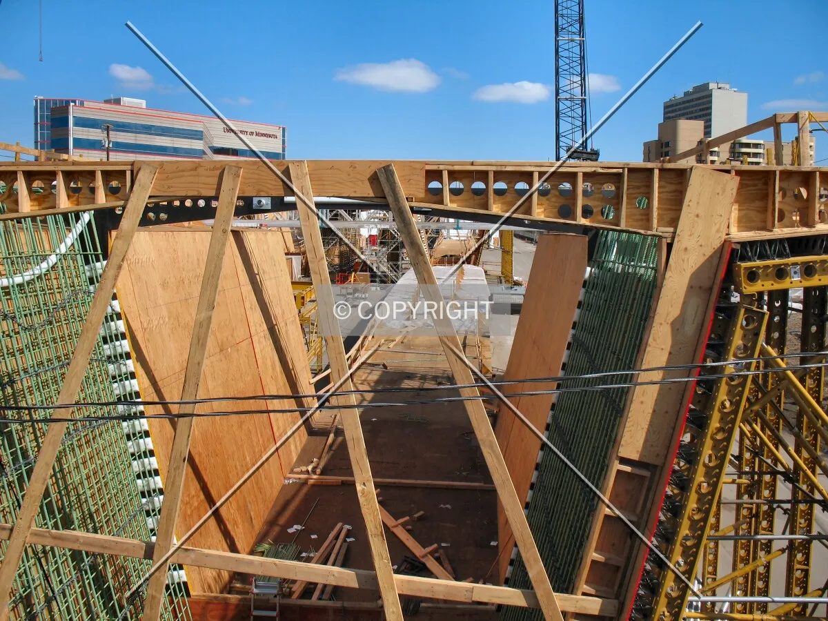 View to the north from the Washington Avenue Bridge over Interstate 35W, now the concrete curing yard for bridge sections