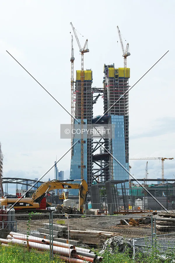 The duplex tower of the ECB including construction cranes