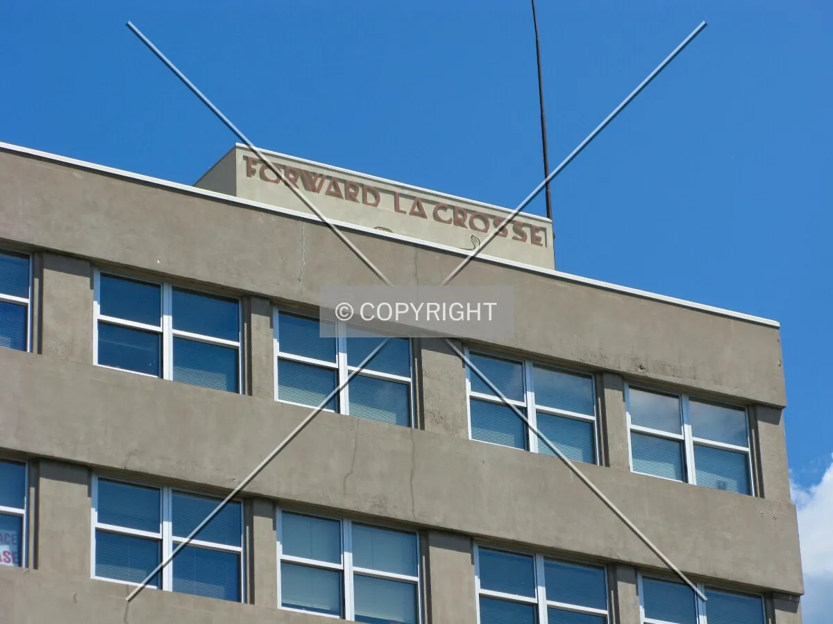Vintage art-moderne slogan atop penthouse