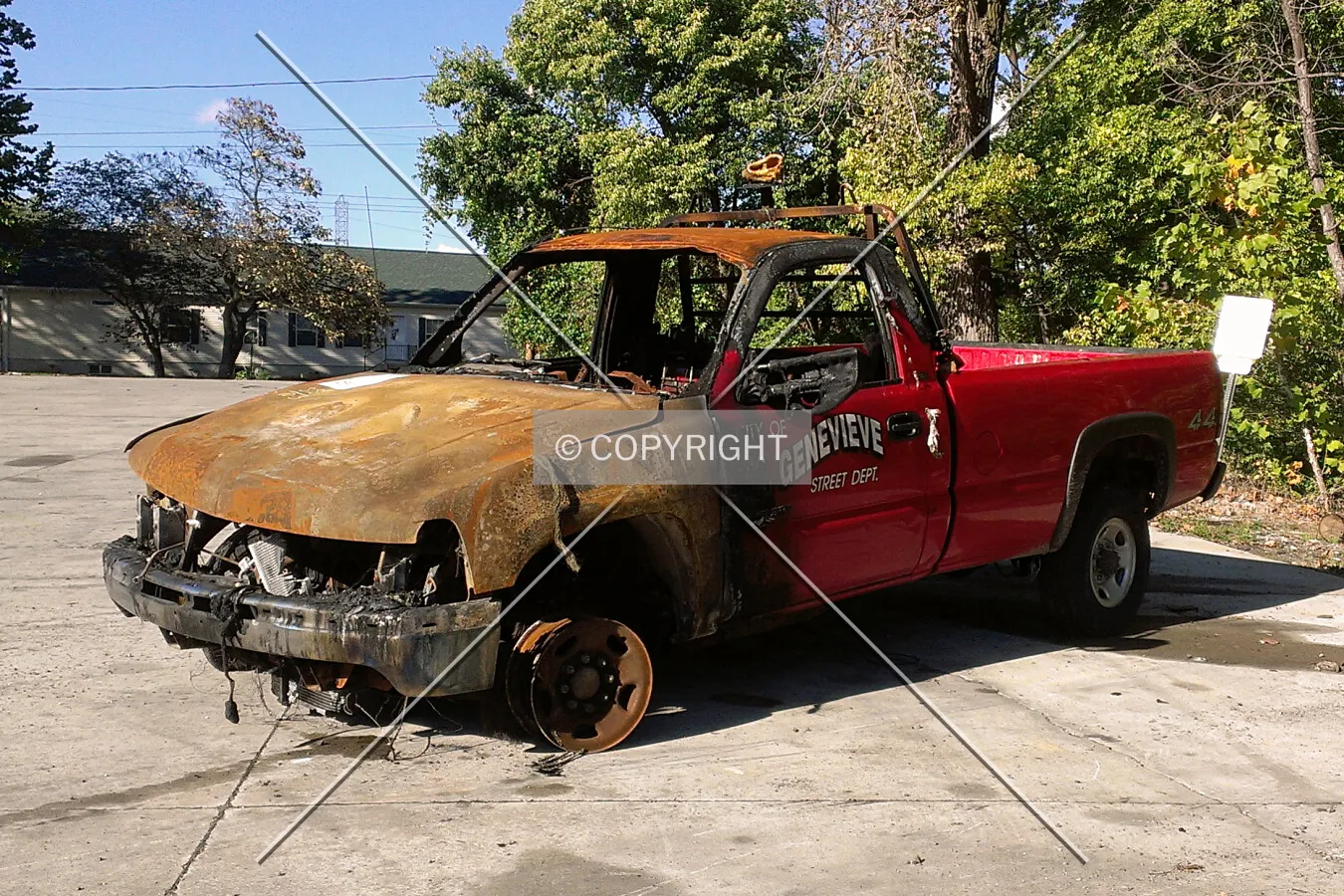 A burned out St. Genevieve Street Department truck sold at the auto auction; October 19, 2013