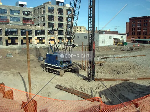 Drilling caissons, from 6th Avenue/4th Street North