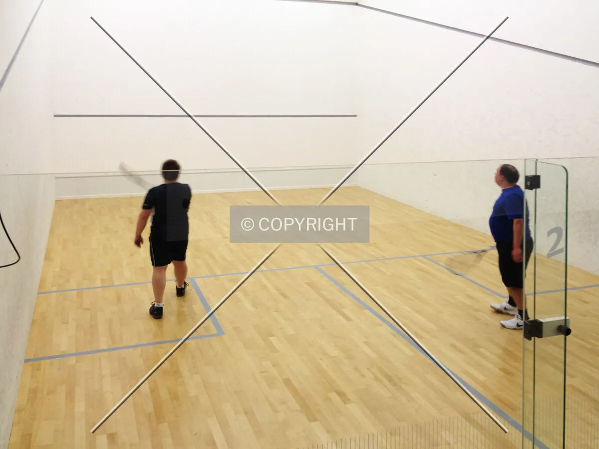 Two men playing squash