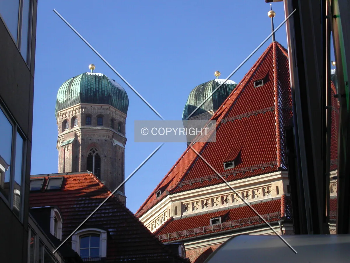 The towers of the church between the roofs of the city