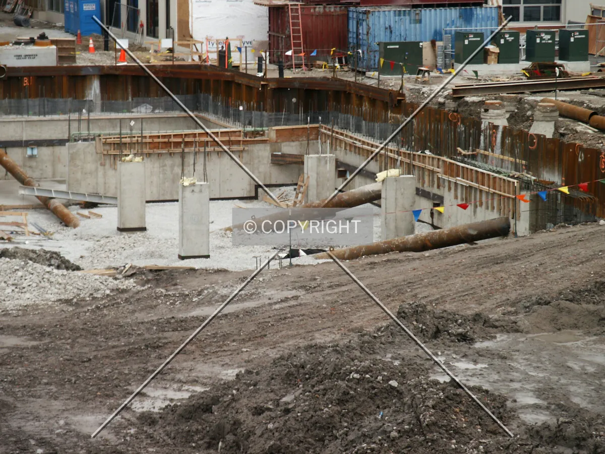 Earth ramp, columns, and retention wall at the southwest corner