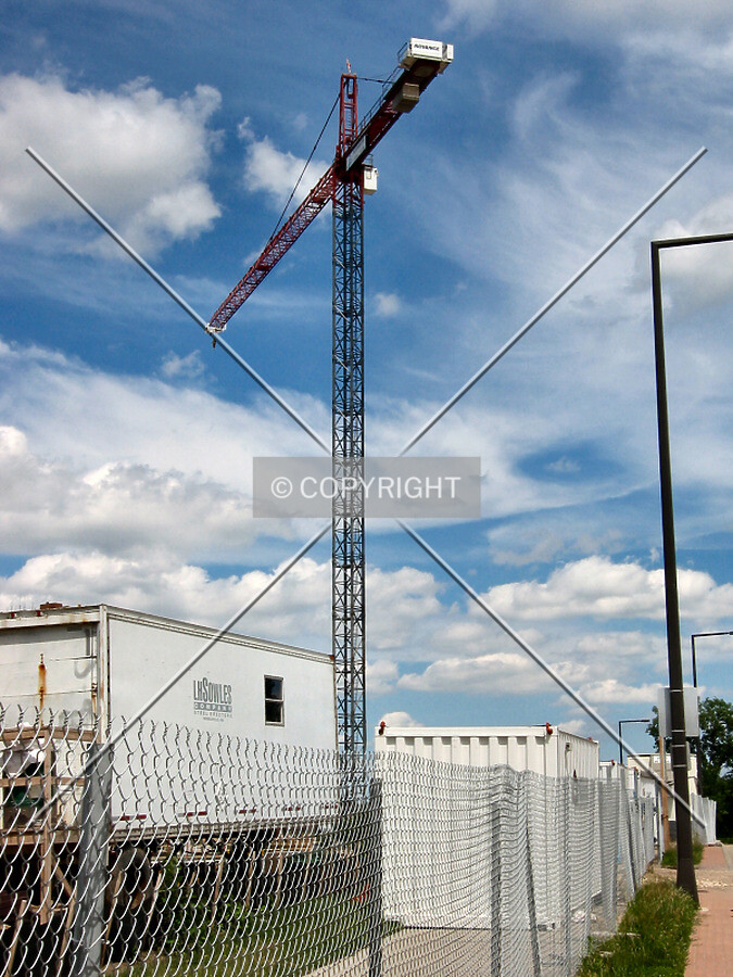 Tower crane rising over Old Shakopee Road