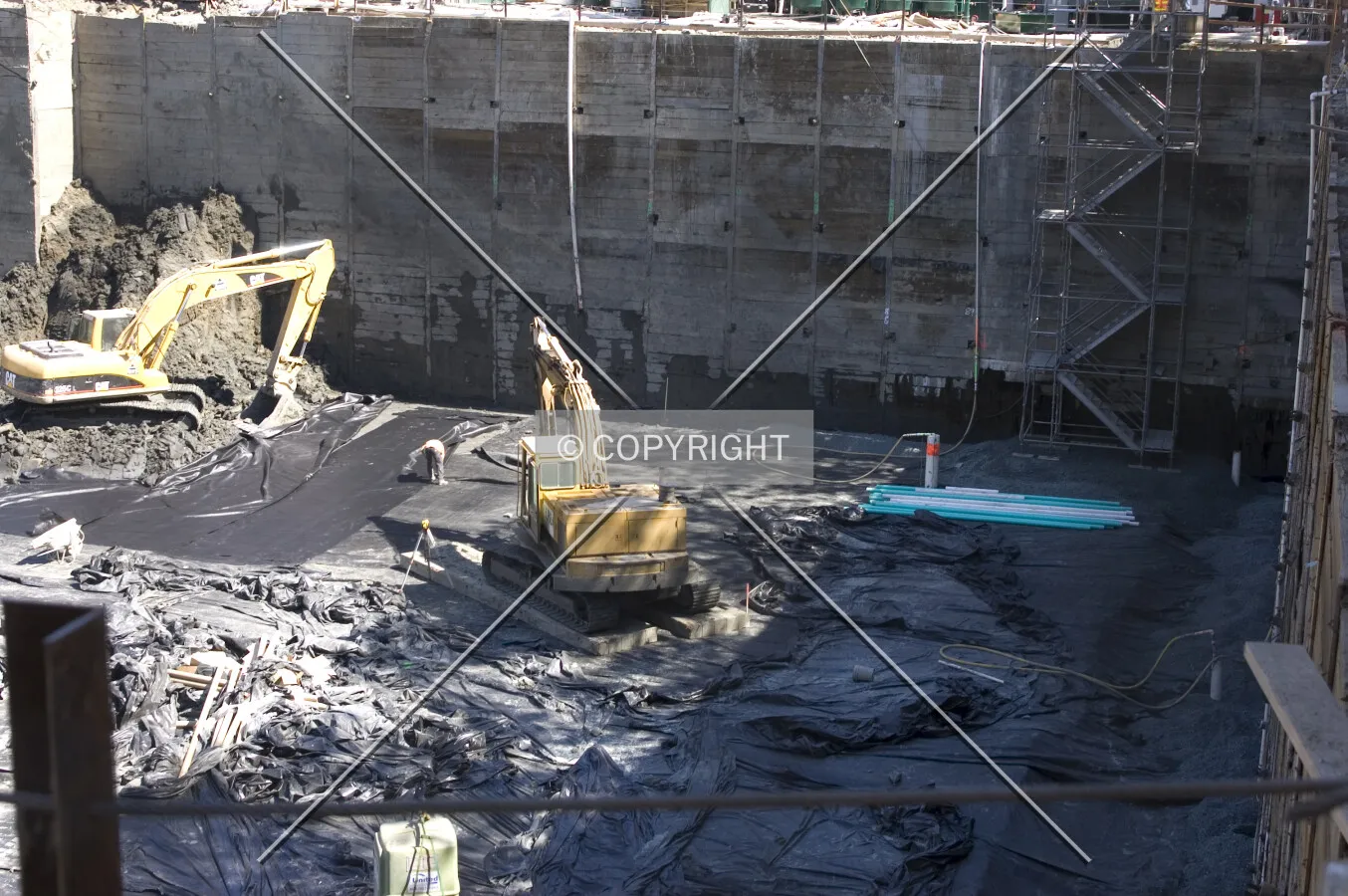 Southwest corner of the excavation pit showing plastic sheeting over earth prior to the gravel fill