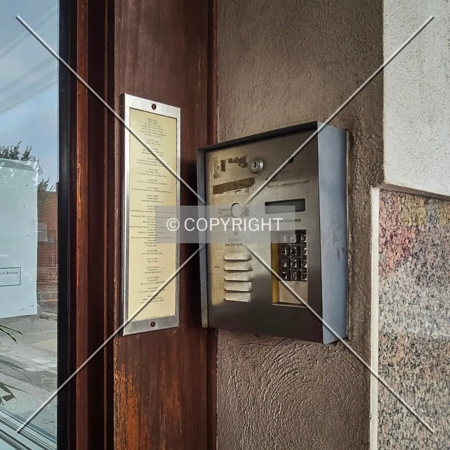 Directory and call box next to the front entrance, Monday, August 10, 2026
