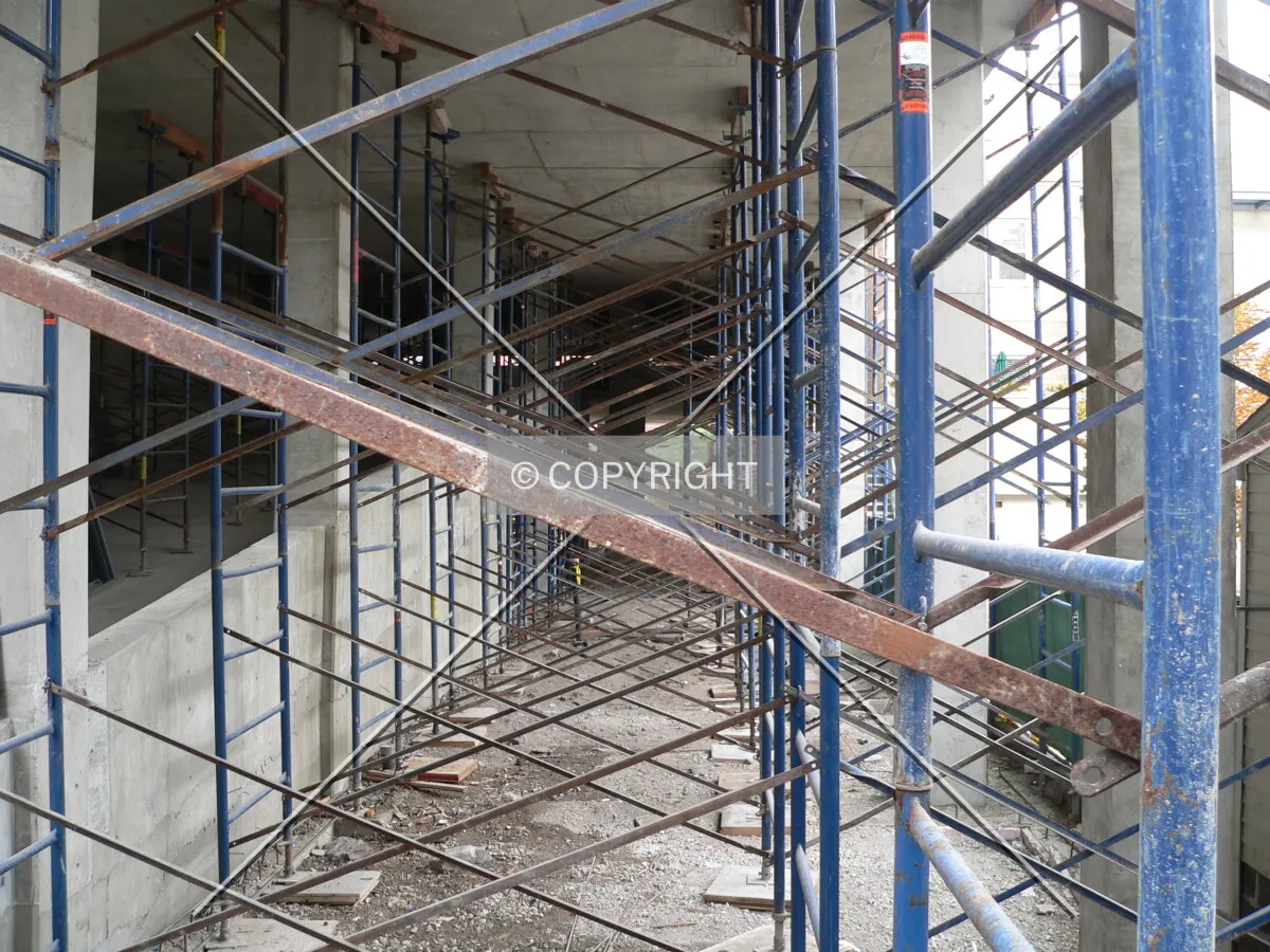Looking through scaffolding and the building