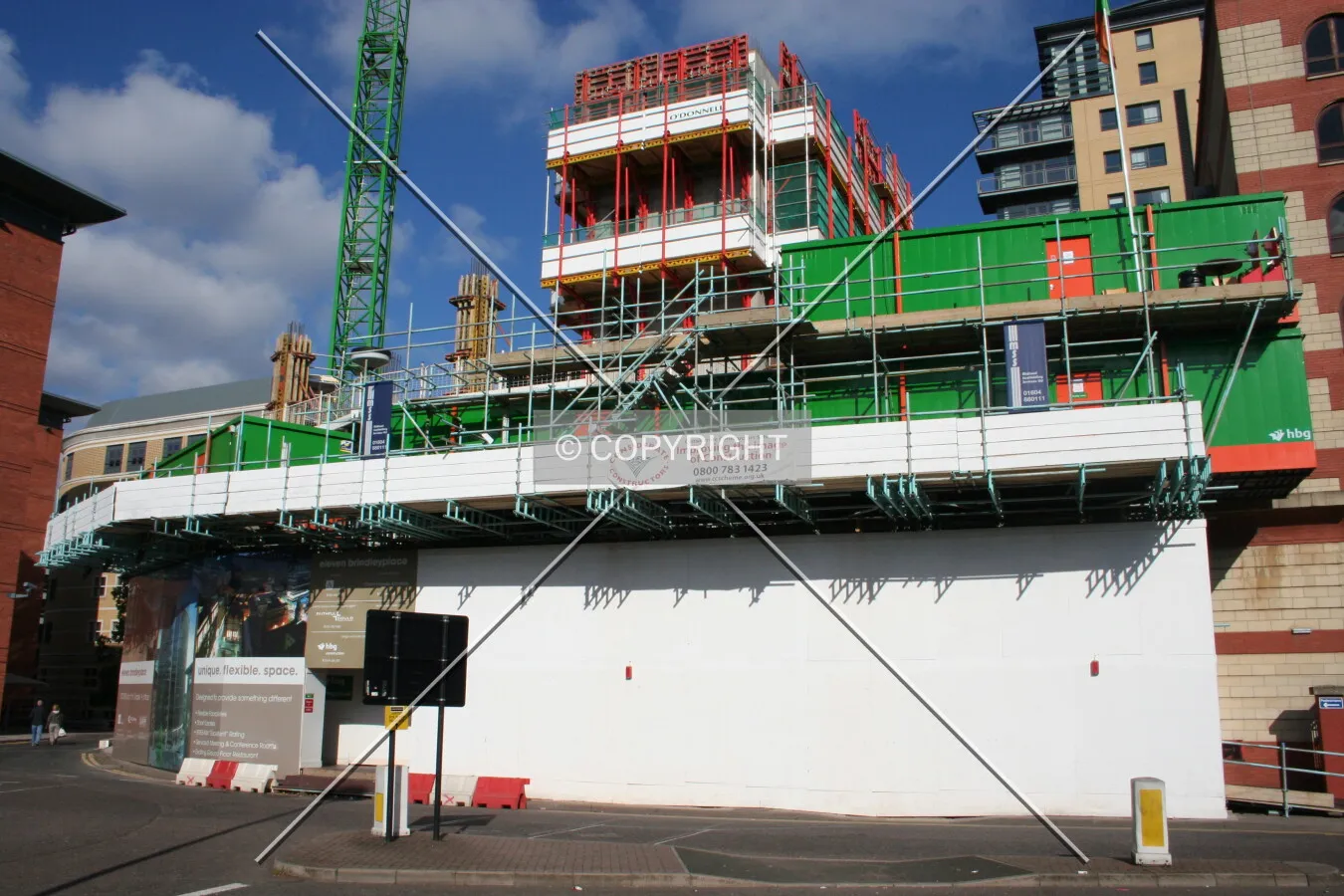 Centre core rising above the site fence