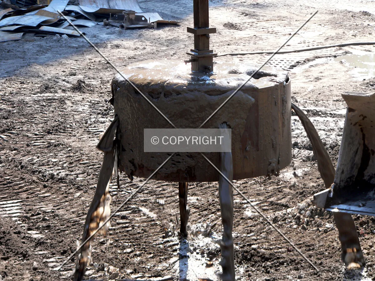 Slurry, mud and clay spilling out of the one-eye bucket
