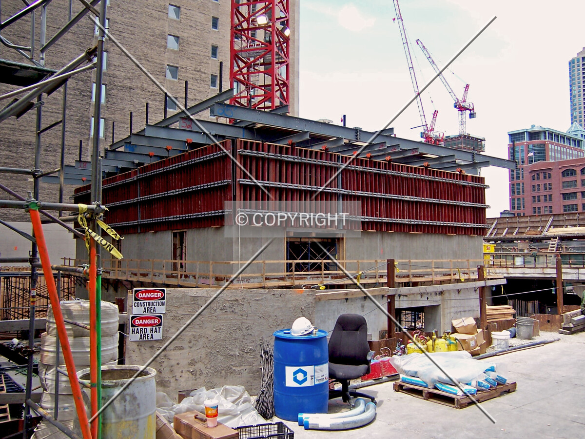 Core rising above street level. Viewed from the southeast along Clark Street. The two tower cranes in the background are for 300 North LaSalle Street