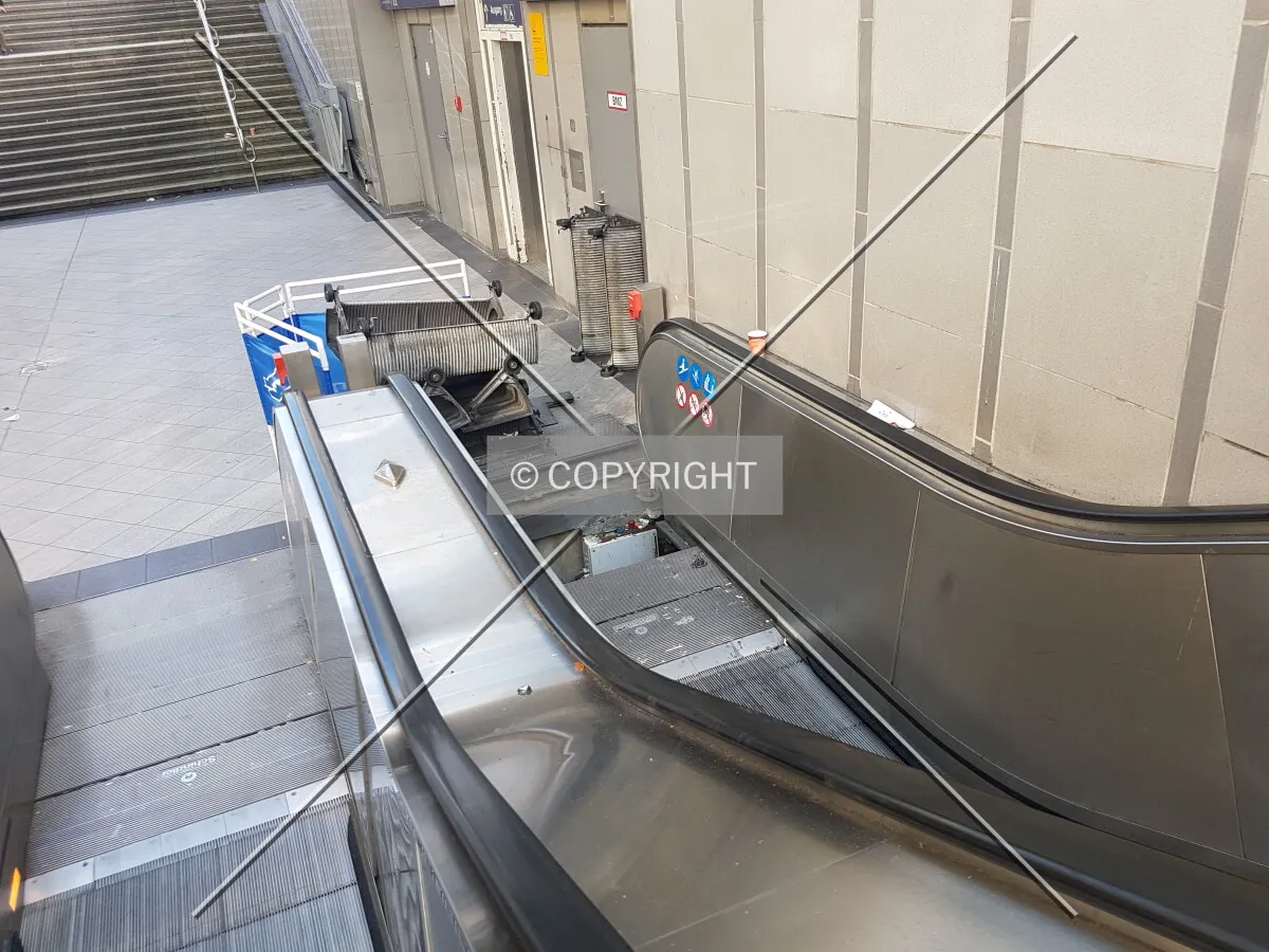 Escalator maintenance - an escalator is repaired
