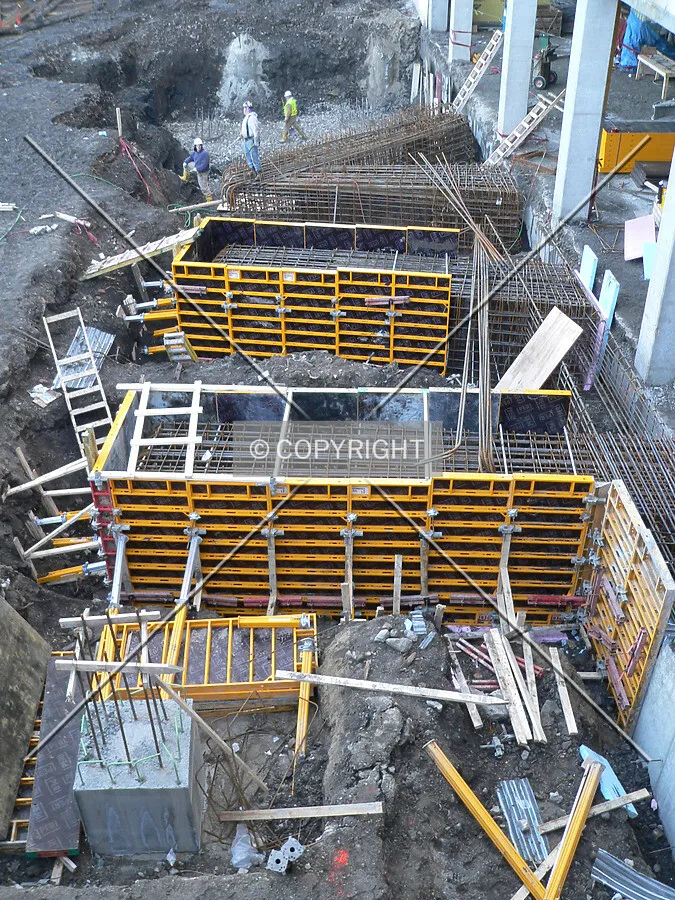 Walls and columns being formed along the western edge of the building site
