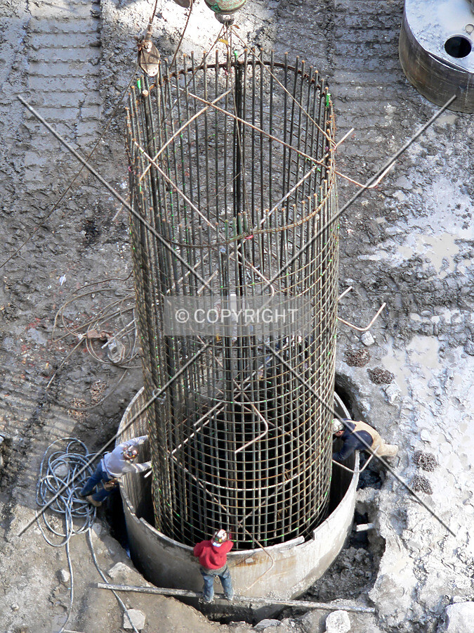 Lowering a massive rebar cage into a caisson hole
