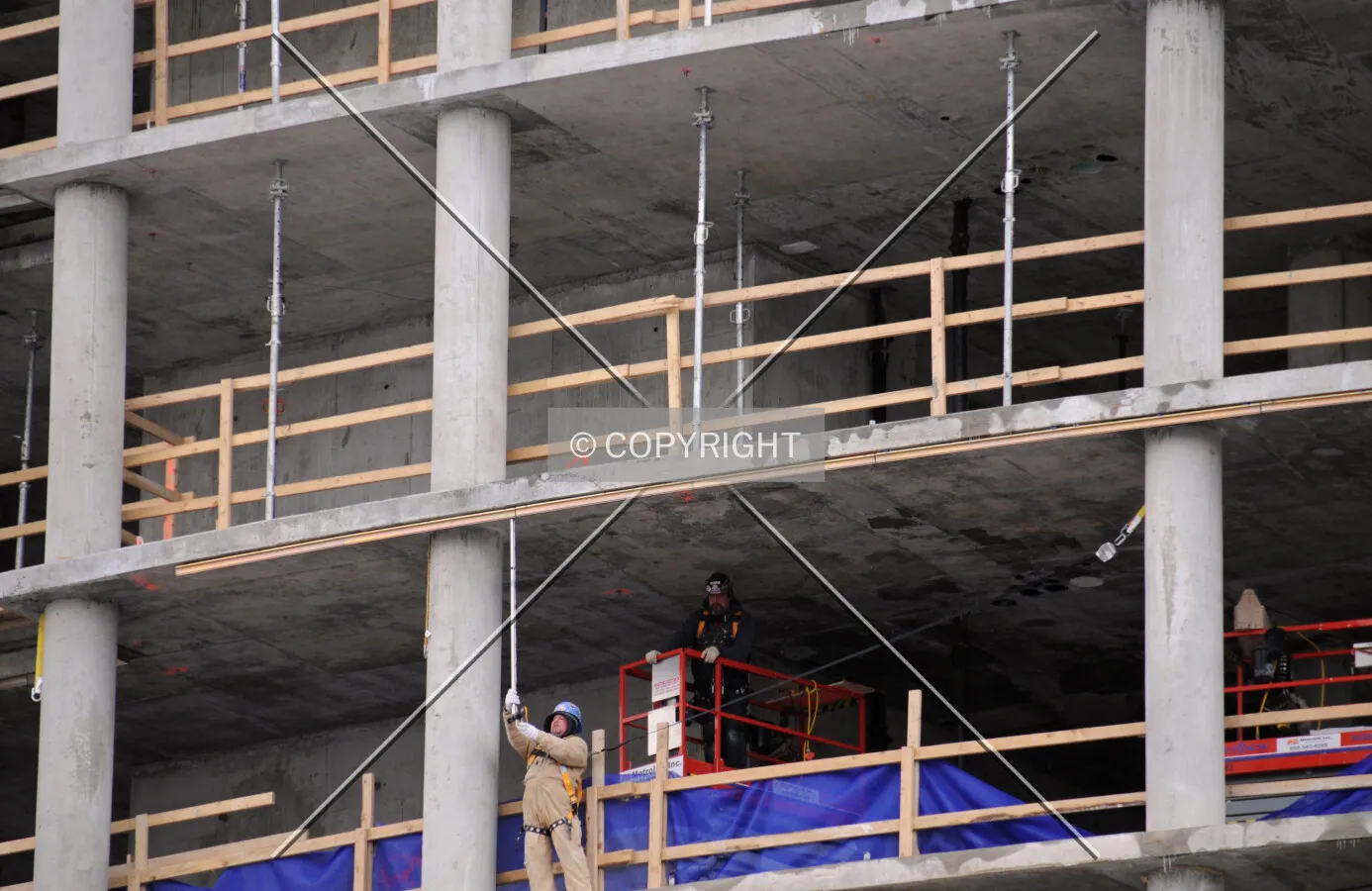 Workers removing pole shores