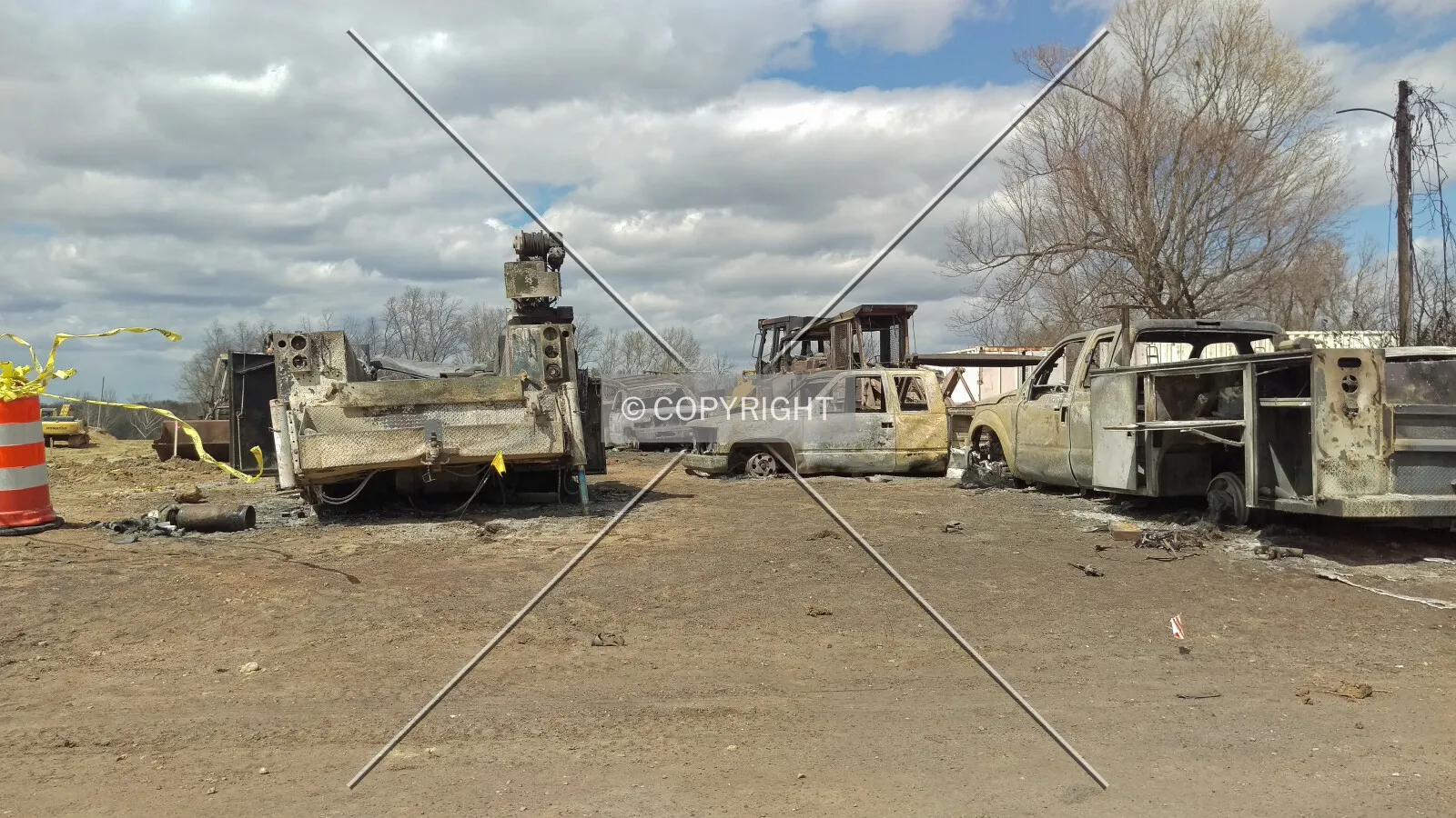 Burned construction worker vehicles at the site of a gas explosion during the construction of the future Villas at Nottingham neighborhood in Maryville, Illinois; April 8, 2016