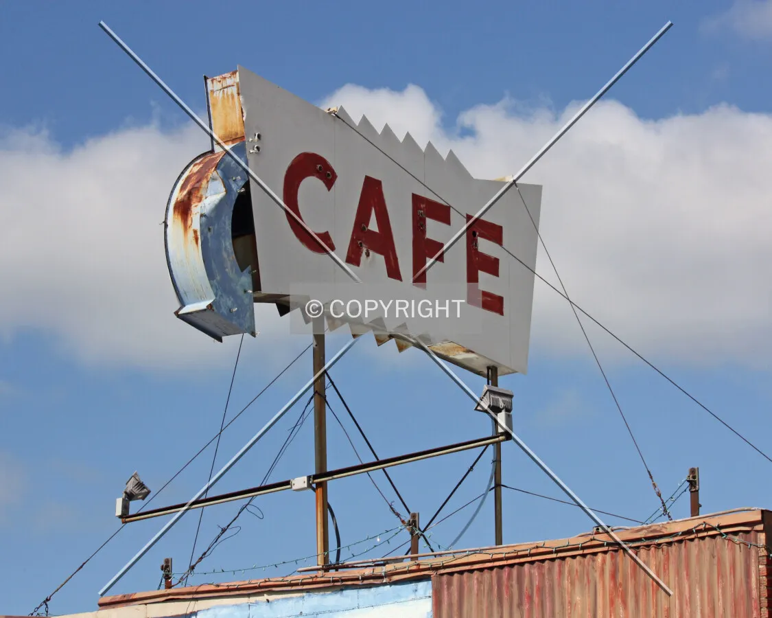 Cafe sign on the roof of the east end of the building