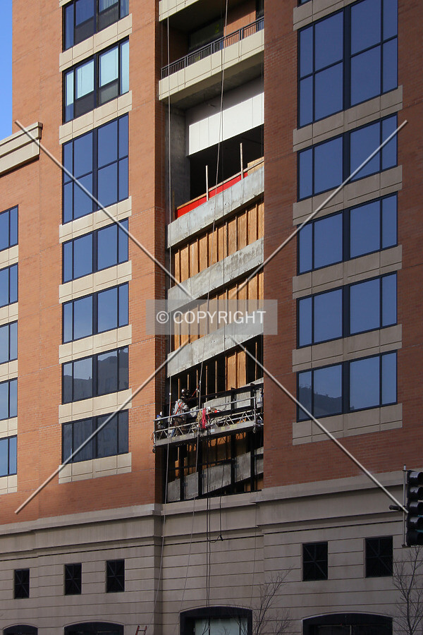 Curtain wall installation over the parking levels