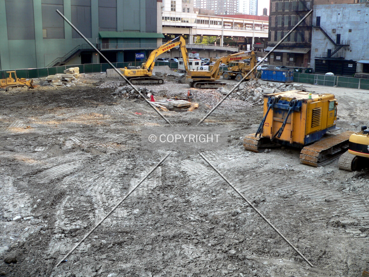 View to the northwest with a caisson crane cab on site
