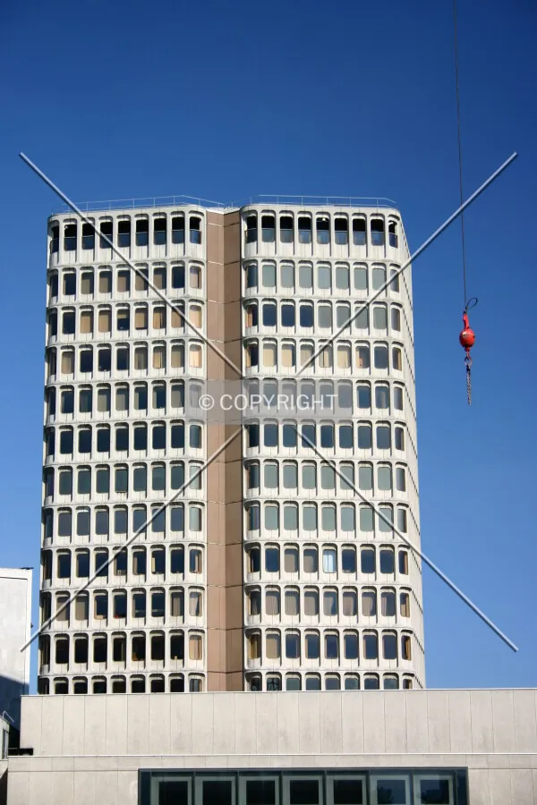 View of the west façade from New Fetter Lane; a crane's gib hangs to the right