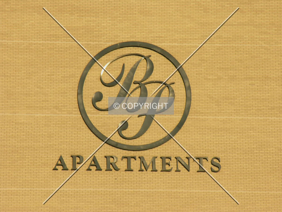 The rear Barrington Place Apartments sign