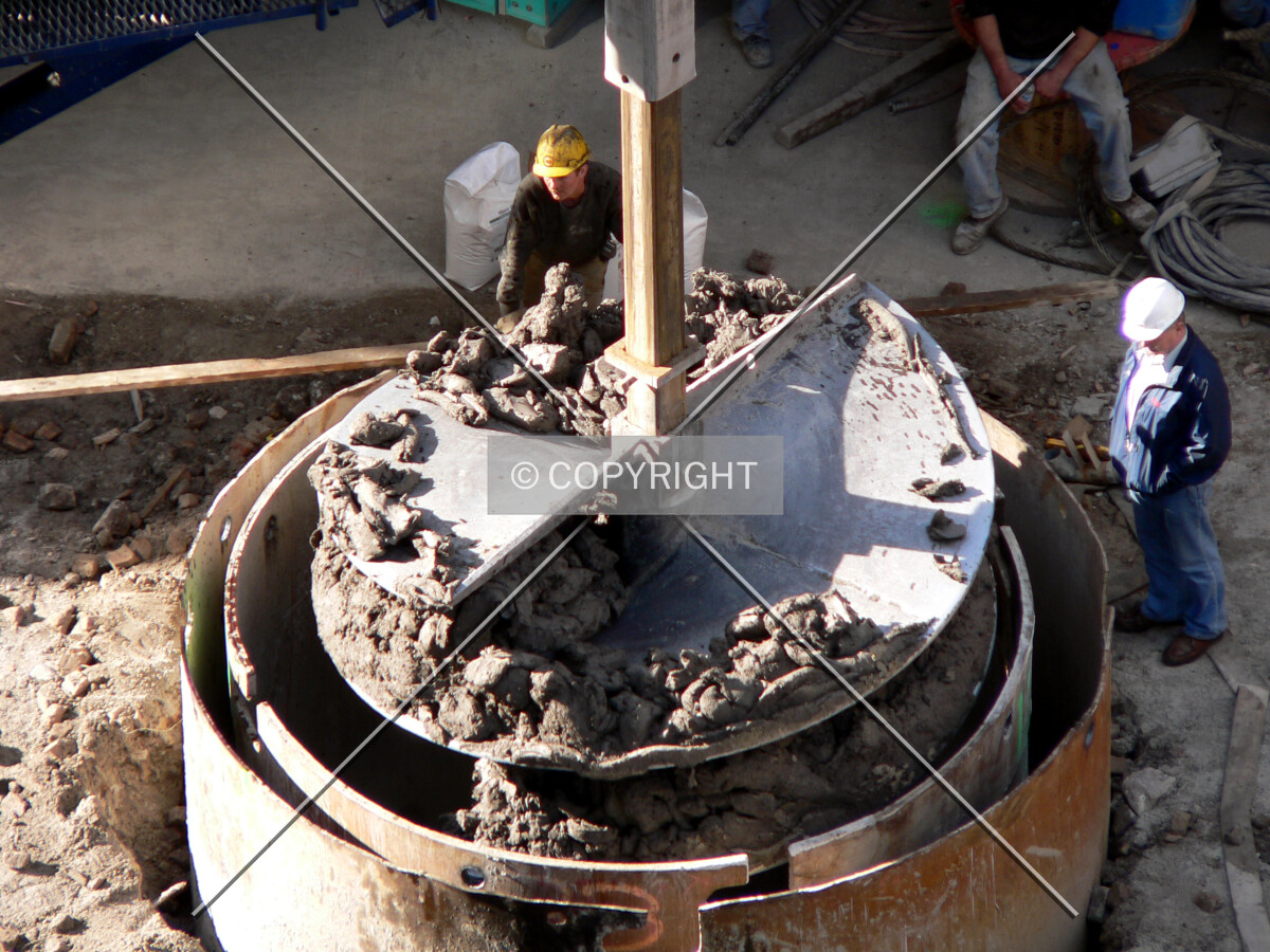 Removing clay out of a caisson hole