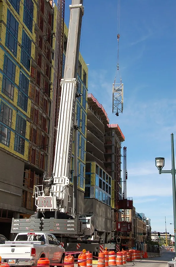 Lowering a section of tower crane