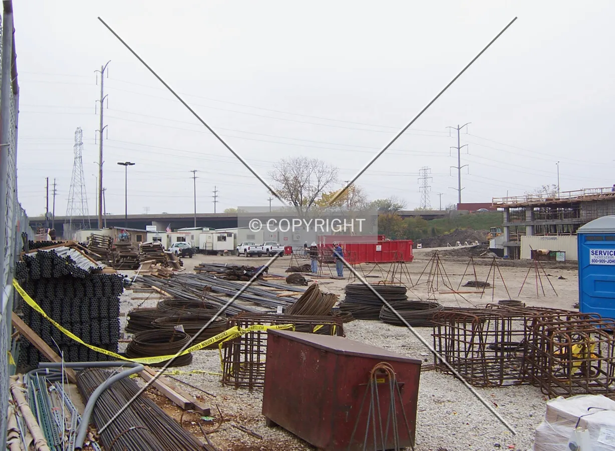Stacks of rebar and conduit on the northern edge of the site