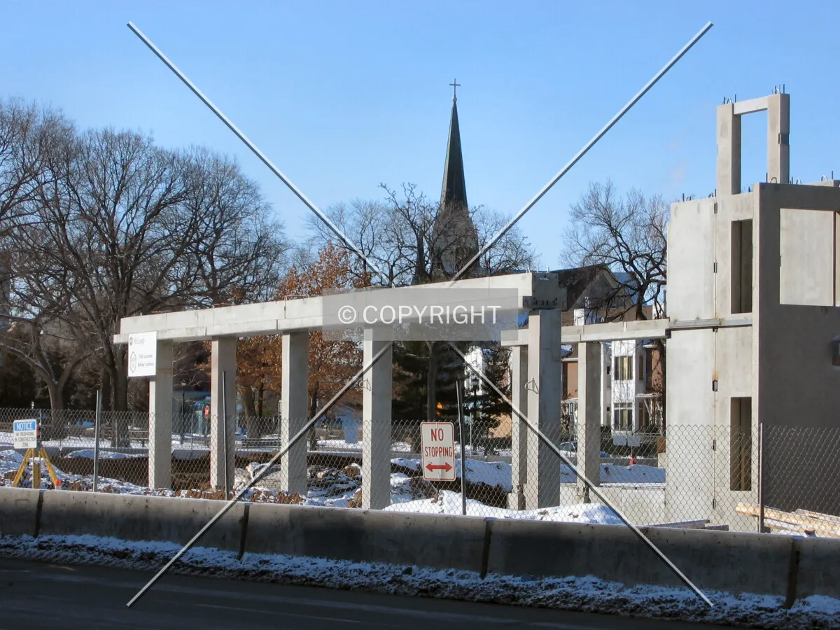 View to the southwest across Central Avenue SE, spire of Our Lady of Lourdes Church beyond Chute Square