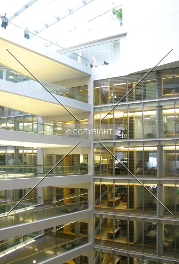 View across the atrium of offices and the skywalks from a seventh floor balcony