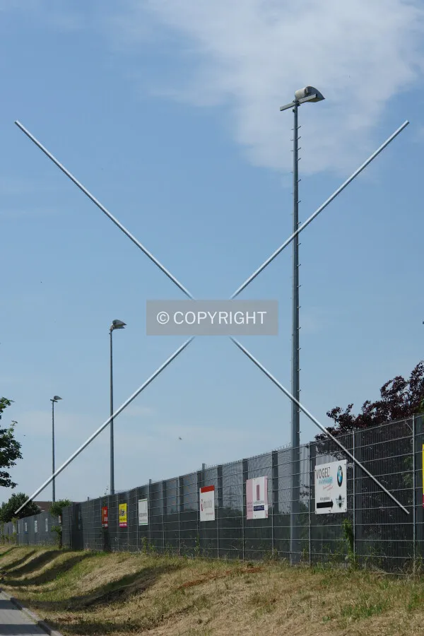 Several floodlights on a soccer field